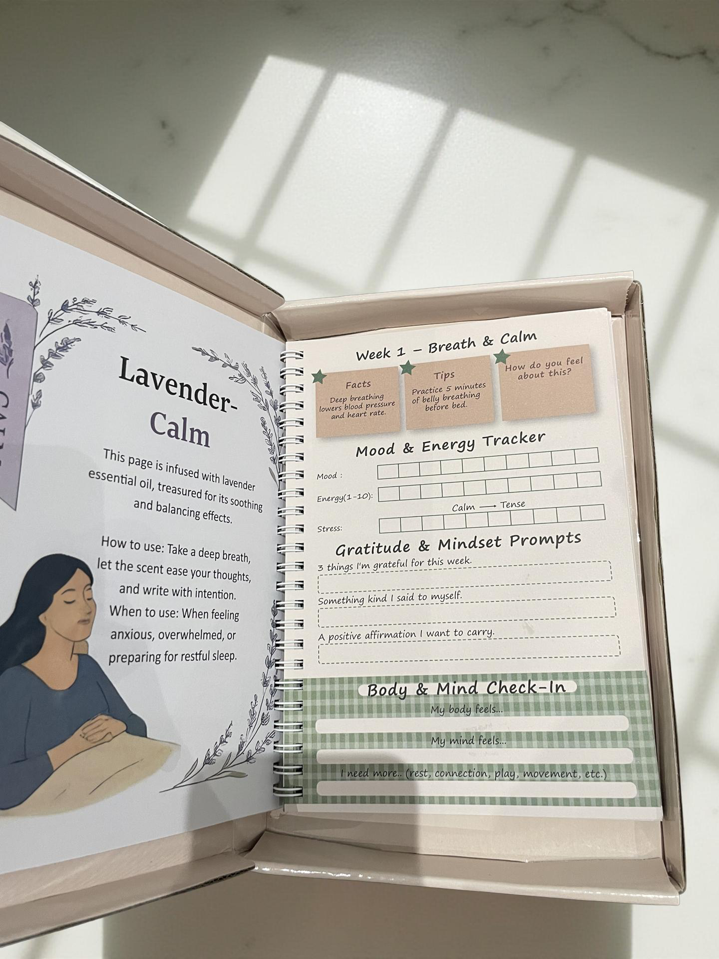 Tolicious Brand essential oil infused journal open to lavender calm mood and energy tracker pages